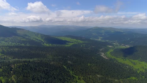 aerial view of a mountain range and forest