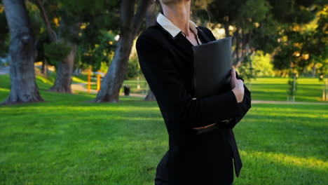 Attractive-caucasian-business-woman-looks-at-the-camera-with-an-expression-of-pride-and-confidence-while-giving-a-big-smile