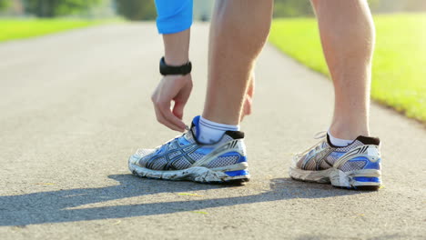 close up runner man feet running outdoors