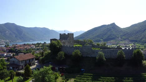 aerial view of ruins of lantieri castle on top of hill in paratico, italy