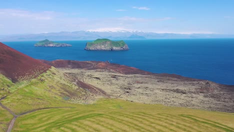 good aerial of eldfell volcano looming over heimaey in the westman islands vestmannaeyjar iceland