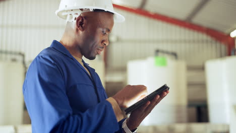 Black-man,-tablet-and-engineer-at-warehouse