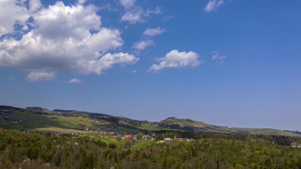 Aerial view of moving clouds above vineyards of Slovenia, hyper, time lapse from above, rural landscape of Ritoznoj near Slovenska Bistrica