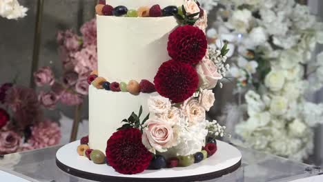 beautiful wedding cake decorated with red flowers