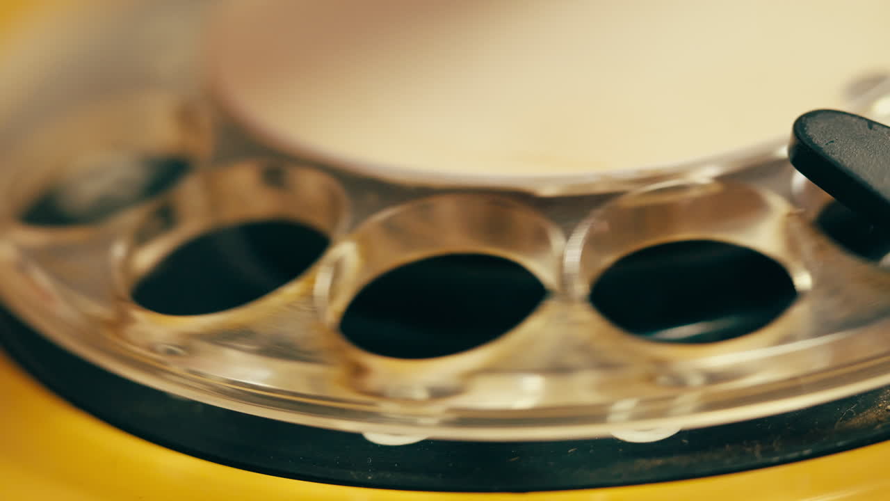 Retro vintage phone, A yellow rotary telephone is displayed on a wooden desk, adding a nostalgic touch