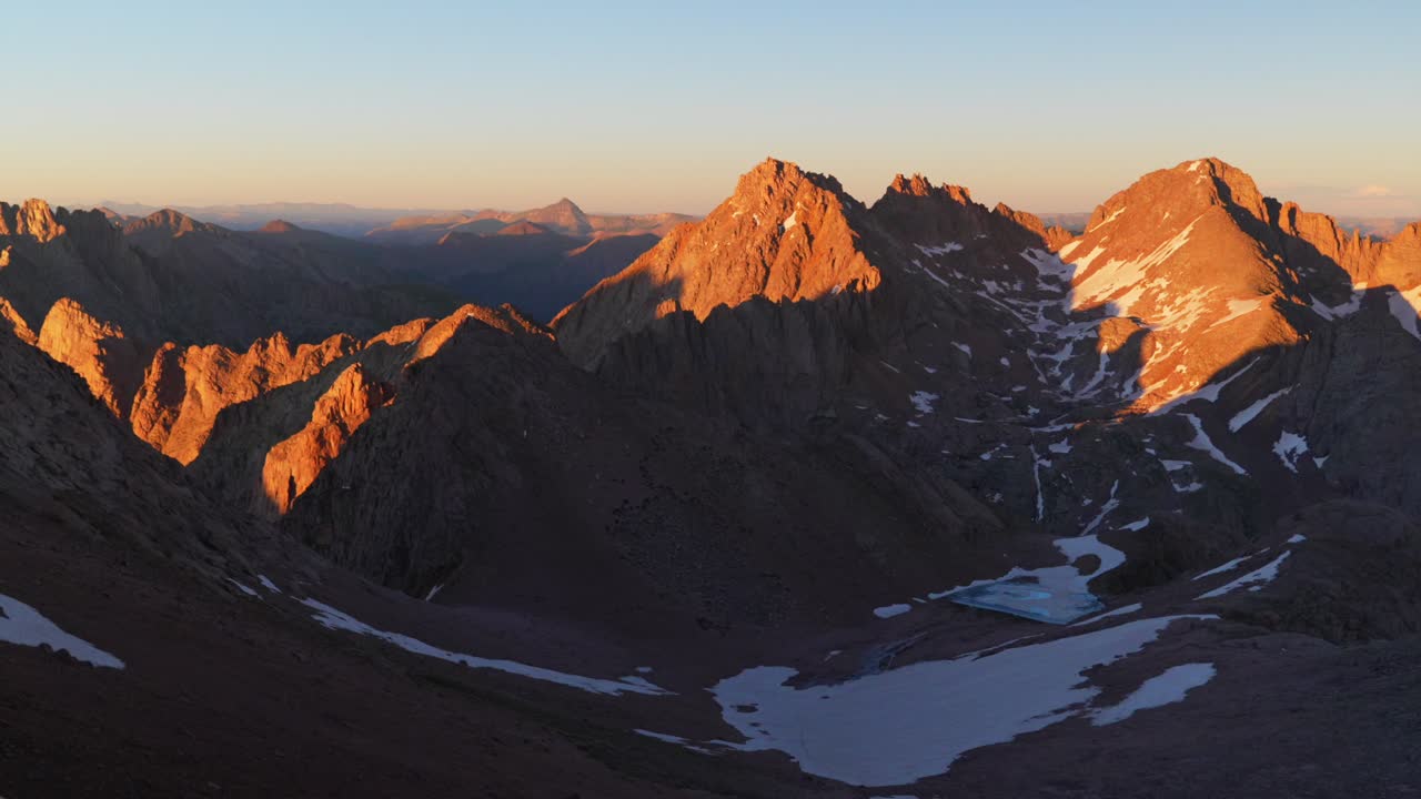 Summer summit sunset Mount Eulos North Sunlight Windom Peak snowcap fourteener Colorado San Juan Range Chicago Basin Rocky Mountains Silverton Durango July stunning Rugged Needles pan right