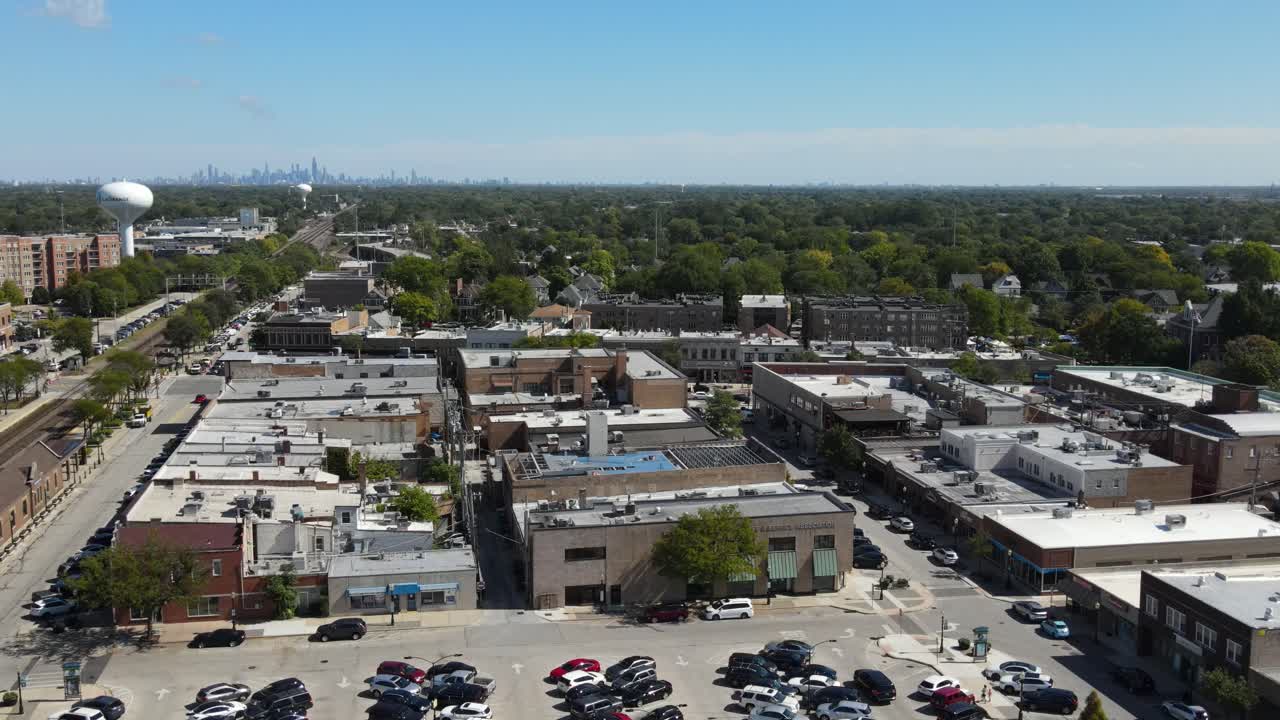 La Grange, IL on a sunny fall day, showcasing streets, buildings, and the suburban landscape With Downtown Chicago in Background. Orbit Left Zoom Day E