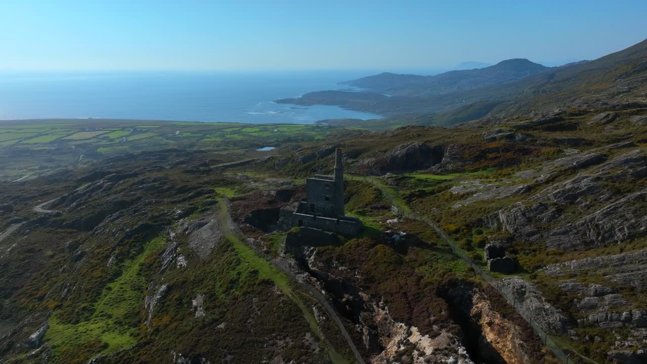 Copper Mine, Allihies, County Cork, Ireland, September 2024. Drone orbits counter clockwise above the ruined building surrounded by farmland and the North Atlantic Ocean in the background.
