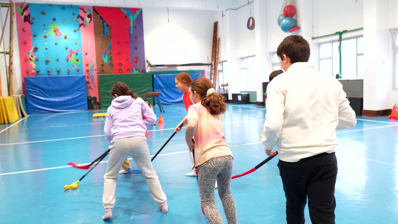 Kids playing floor hockey