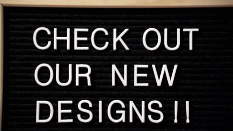check out our new designs black letter pin board with white words pressed in with wood frame, camera close pulling out