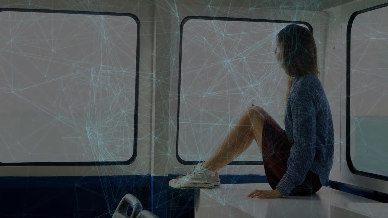 Person sitting by window with network of connections animation overlay
