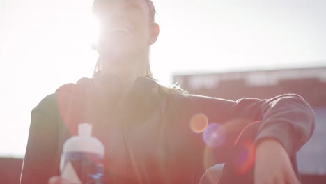 Low-angle-view-of-woman-taking-a-sip-of-refreshing-water