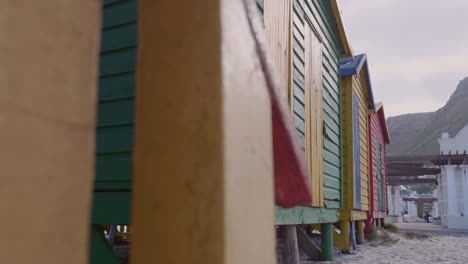 revealing shot of colourful beach huts and beach houses in muizenberg near cape town in south africa