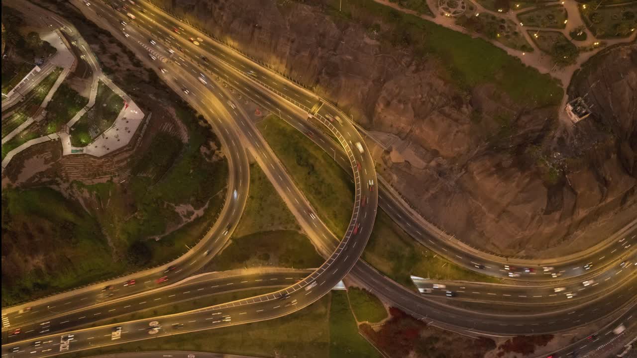 Aerial Time Lapse of Busy City Highway Interchange at Night