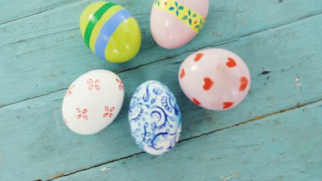 painted easter eggs on wooden surface