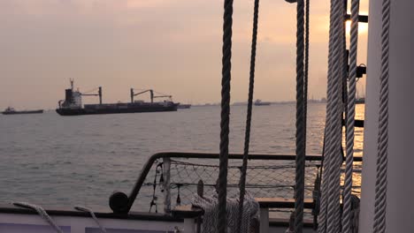 sailing singapore harbour at sunset in beautiful red sky at night