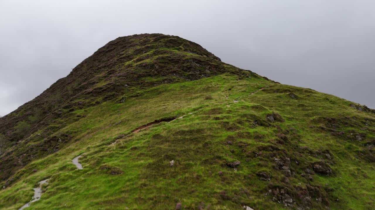 Drone footage of a misty ascent of Fleetwith Pike's craggy ridge in the Lake District National Park