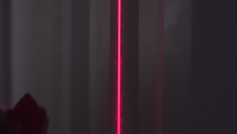 red laser line on a wall