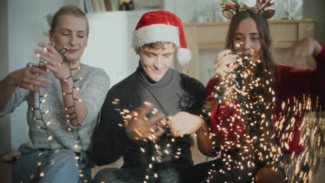 Man-and-women-sorting-tangled-glowing-lights