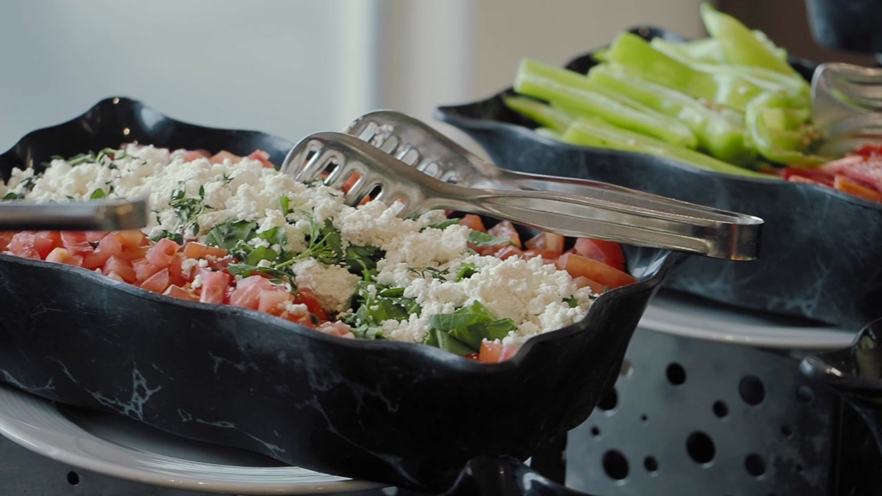 Fresh Tomato and Feta Cheese Salad with Herbs at a Buffet