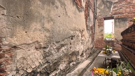 tour of weathered temple with buddha statues