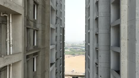 concrete building under construction in karachi, pakistan, showcasing the structural framework and urban development