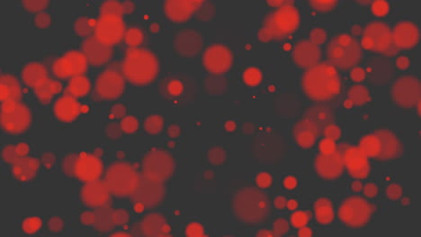 Fly-and-falling-red-round-particles-with-glitters-on-black-gradient-1