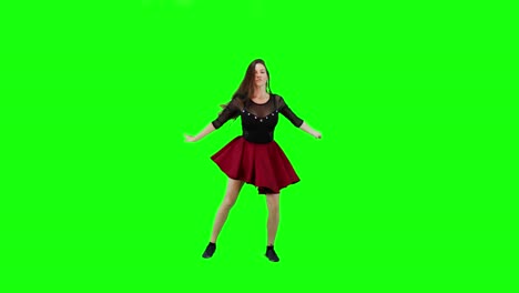 young woman dancing on a green screen background