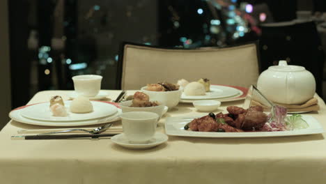 formal setting of a dinner table on a penthouse