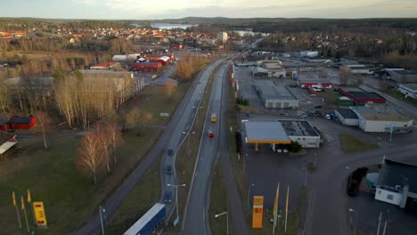 fast driving fire trucks with flashing lights on highway in city, aerial tracking