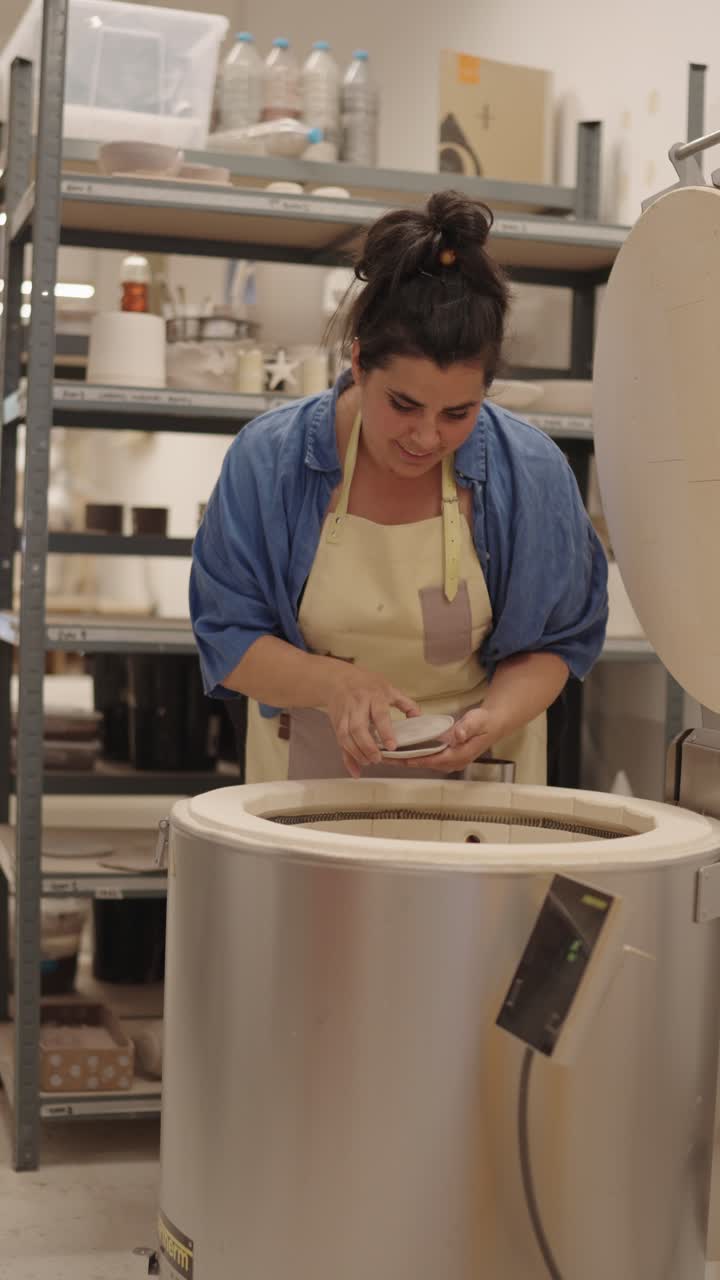 Woman Working with Ceramics in Pottery Studio
