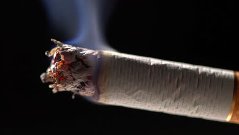a close-up view of a burning cigarette with glowing embers, highlighting the smoky texture and details of the smoking experience