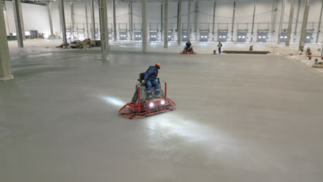 concrete floor pouring and finishing in a warehouse