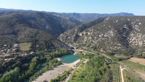 Large-aerial-view-of-Gorges-de-l'Herault-sunny-day-lake-with-a-beach