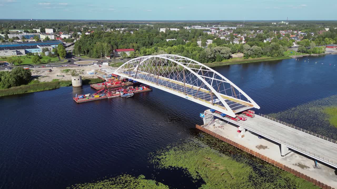 New arch vehicle bridge is installed over Parnu River in Estonia