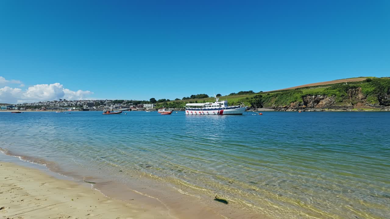 Pan from right to left across estuary towards Padstow, Cornwall, UK