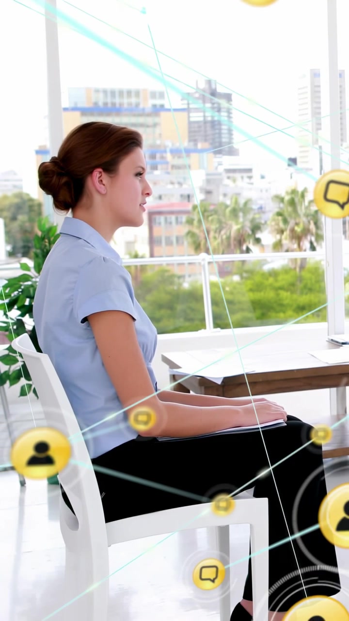 Vertical video: Woman at desk knee HUD starting yellow dots growing across face for business data