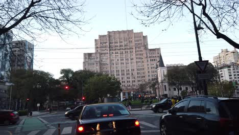 panoramic at houssay plaza, cordoba avenue and clinic public hospital of buenos aires city in sunset, motion vibrant city park