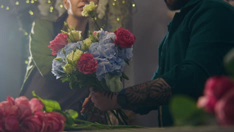 florists making a bouquet of flowers