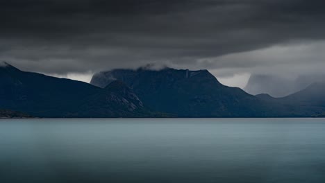 heavy rainy clouds passing above the fjord