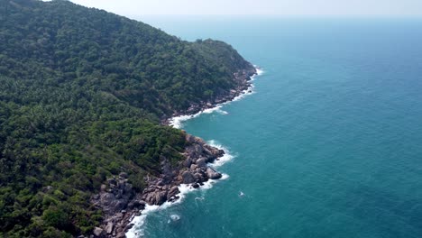 rocky cliffs, mango bay , ko tao, dramatic spectacle, rising above ocean water