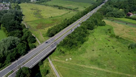 cars crossing a bridge over the river stour