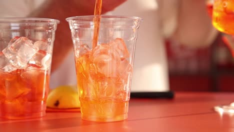 pouring aperol spritz cocktails