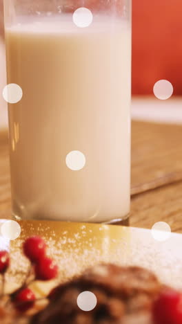 animación de manchas blancas sobre leche y galletas en navidad