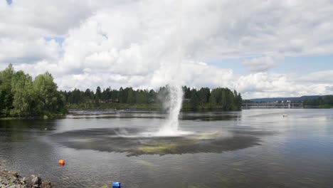 Slow-motion-of-the-fire-brigade-rescue-helicopter-carries-water-in-the-tank-in-Norway-forest