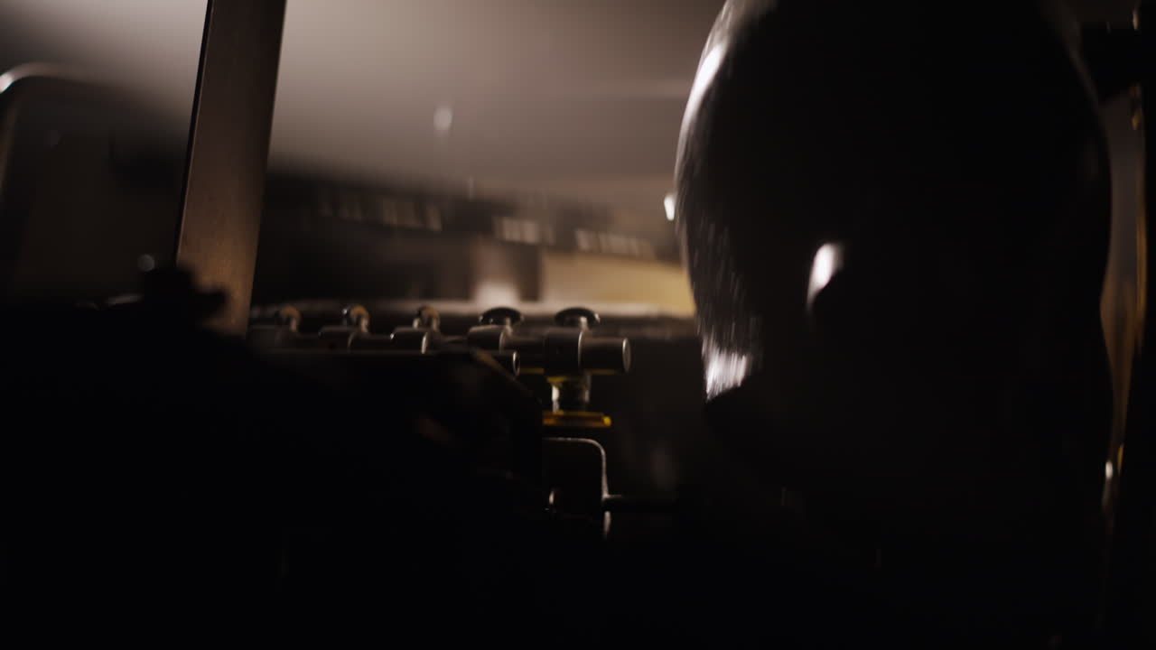 Close-up view of industrial machinery in a dark setting