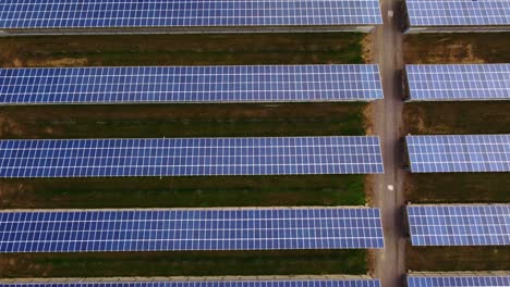 Sideways-aerial-of-vast-Solar-Panel-Power-station,-bird's-eye-top-down-view