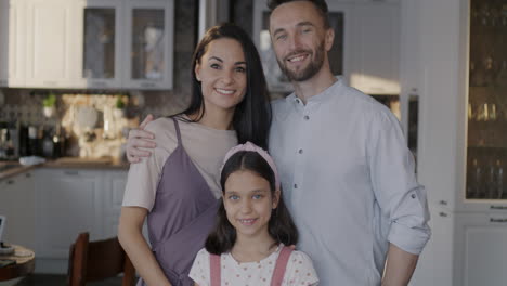 happy family portrait in kitchen