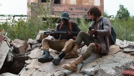 men guarding an abandoned building