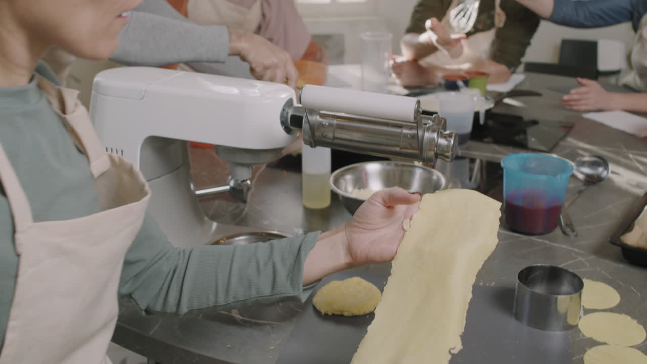 People making pasta together